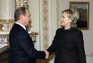 Then-Secretary of State Hillary Clinton shakes hands with Vladimir Putin back in 2010. (Getty Images)
